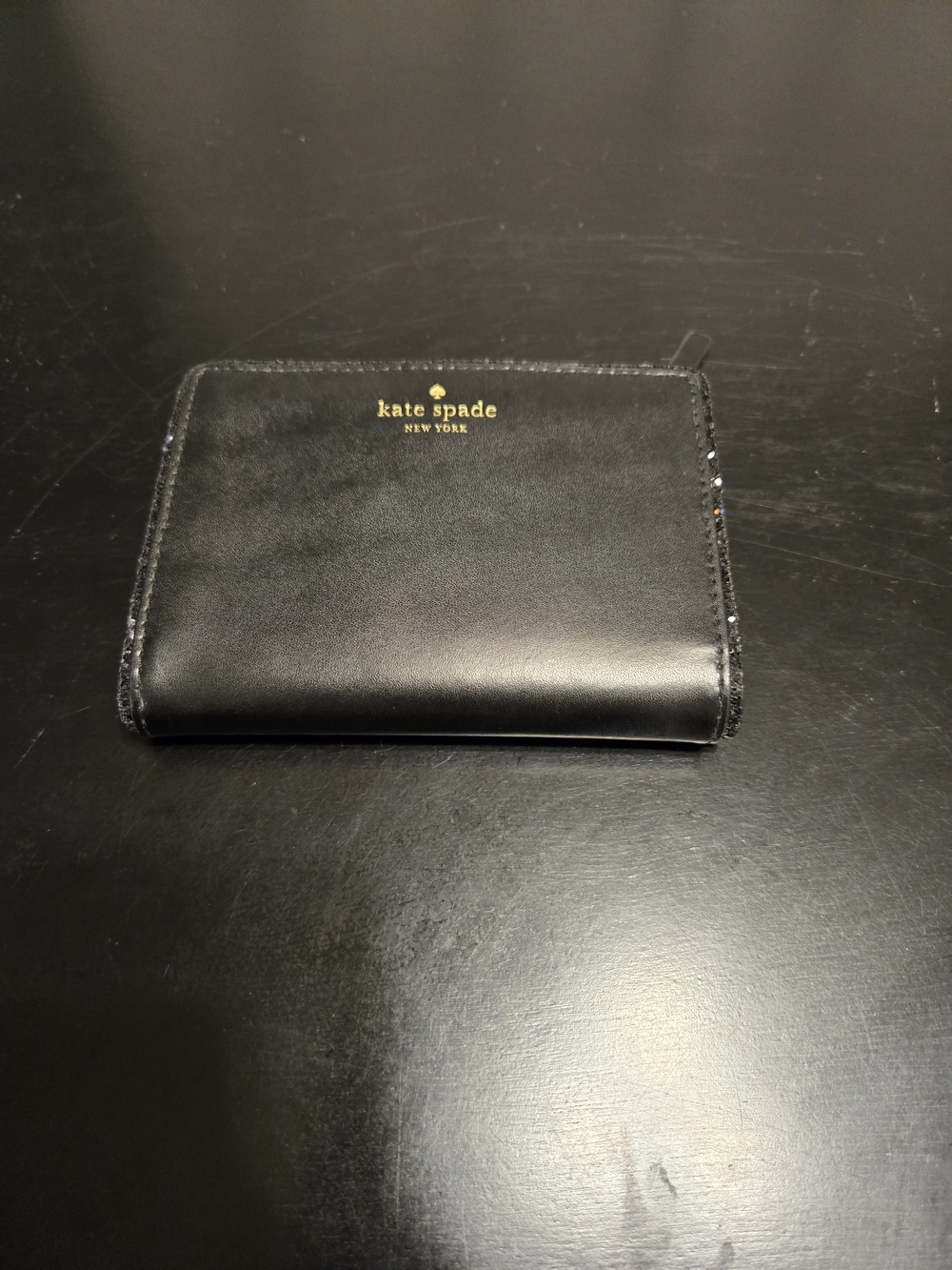 kate spade black leather zip-around wallet with gold logo